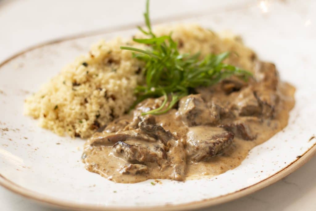 Beef stew with wild mushroom served with couscous Suffren On The Go